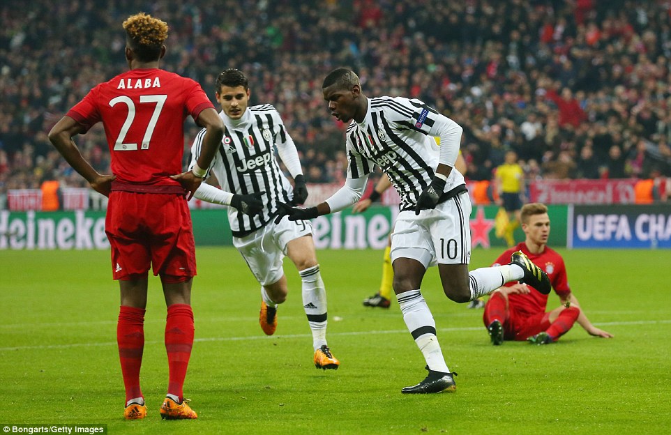 France international Pogba wheels away to celebrate after giving Juventus an important lead with Alvaro Morata